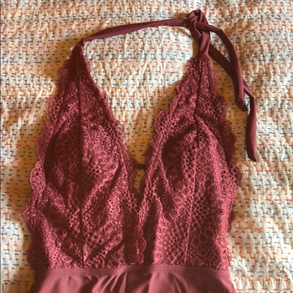 Cute lacy deep V bathing suit.